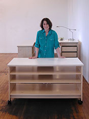 Art Studio Rolling work table has adjustable large art storage shelves and art studio desk.