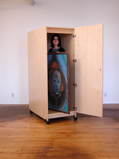 Art Storage Cabinet for storing art with wheels and locking door.