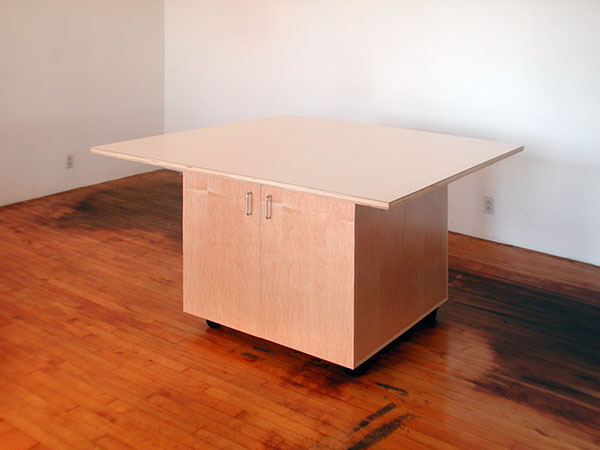 Art Studio Rolling Work Table has a 5' x 5' white laminate working surface. 