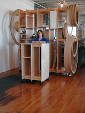 Art Storage for the art studio holds round and rectangular paintings.