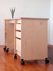 Art Storage Workstation is a Table & Desk with art storage drawers and shelves.