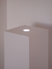 White lacquer sculpture pedestal  base with recessed adjustable lighting.