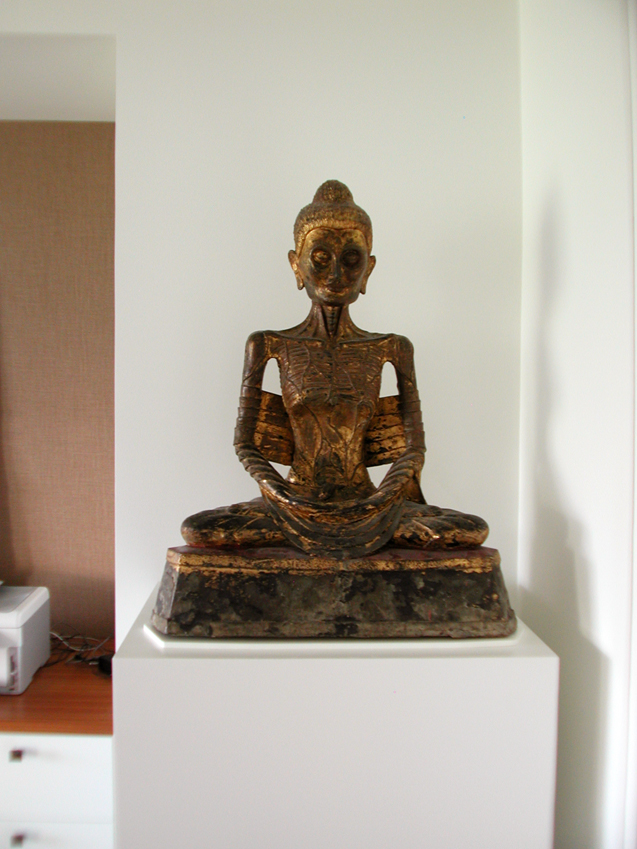Sculpture Pedestal with a white lacquer finish for a bronze Buddha.