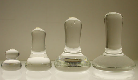 Mullers are hand made of solid glass for mixing paint pigments.